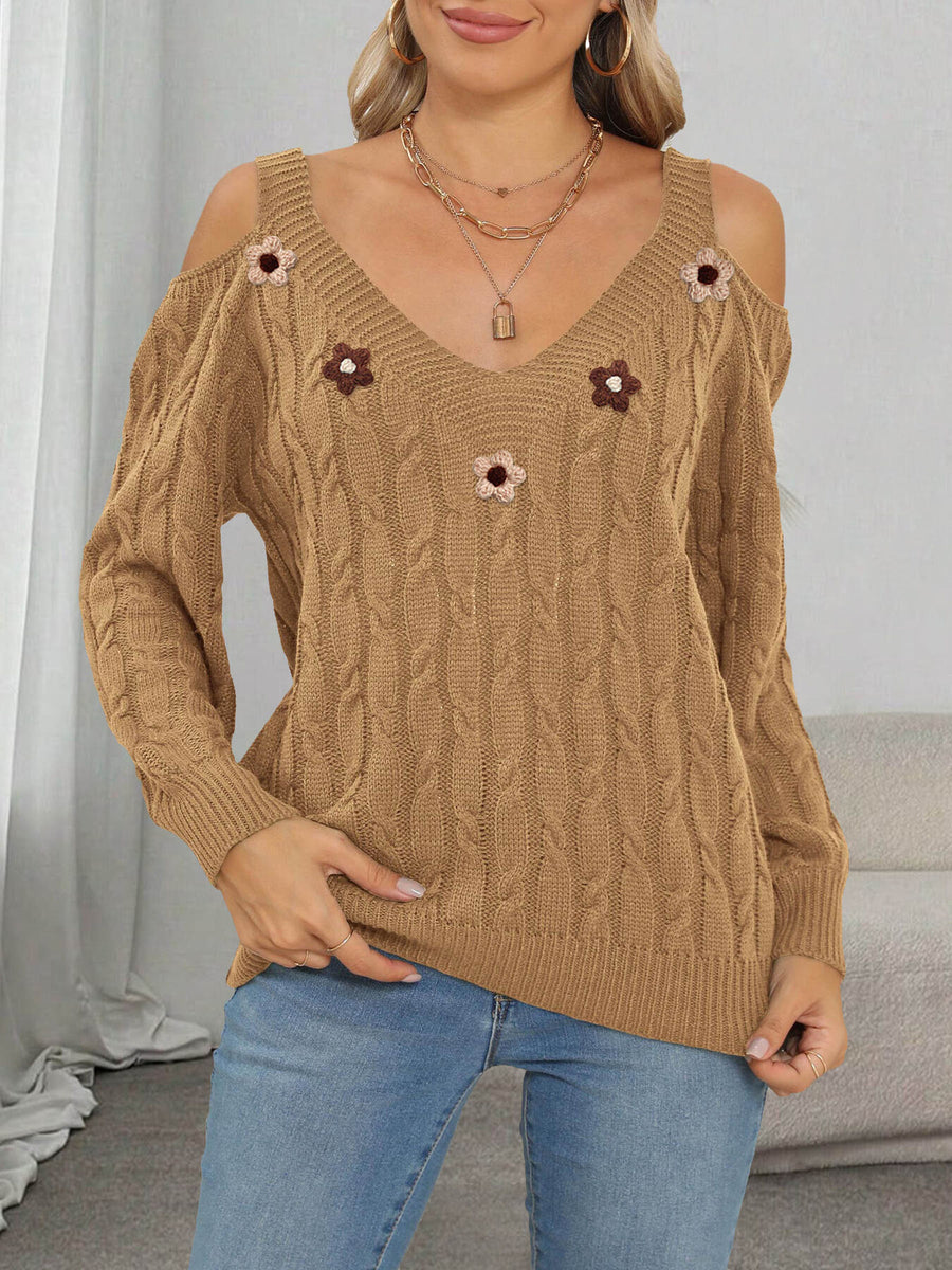 pullover sweater in black with cable knit and applique