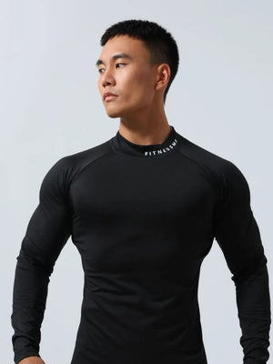 Black long sleeve compression top with mock neck and white logo detail