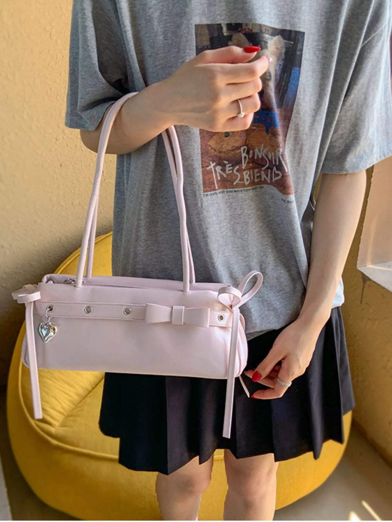 Chic pink PU leather shoulder bag with bow detail and heart charm