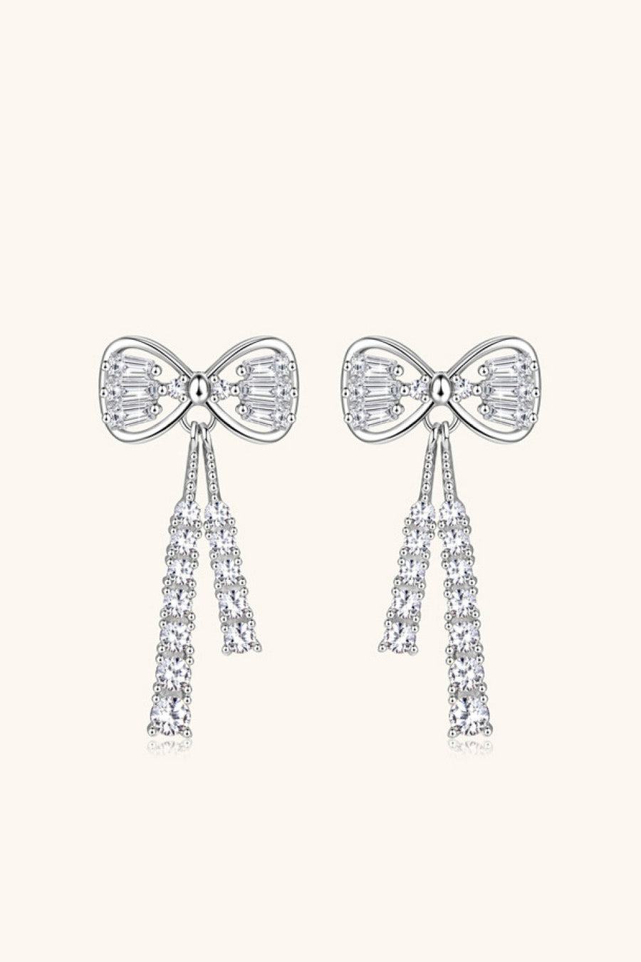 Silver bow drop earrings with baguette and round clear crystals