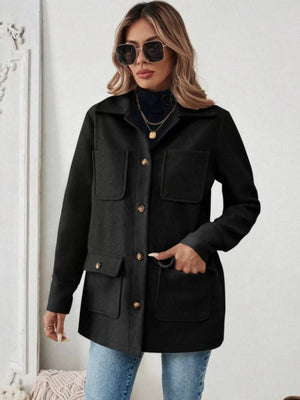 Black button-front pocketed trench coat with spread collar and buttoned cuffs.