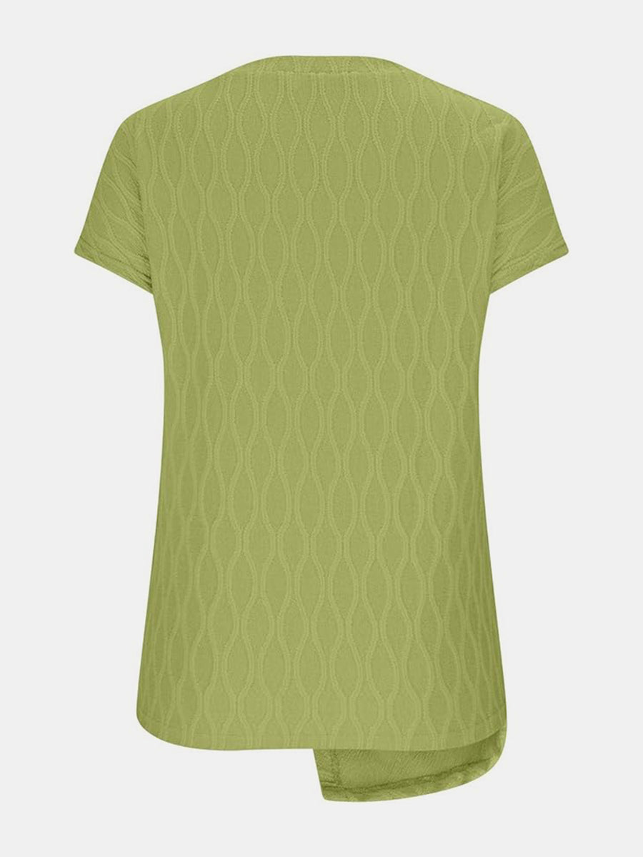 Yellow-green textured tee with short sleeves and asymmetric hem detail.