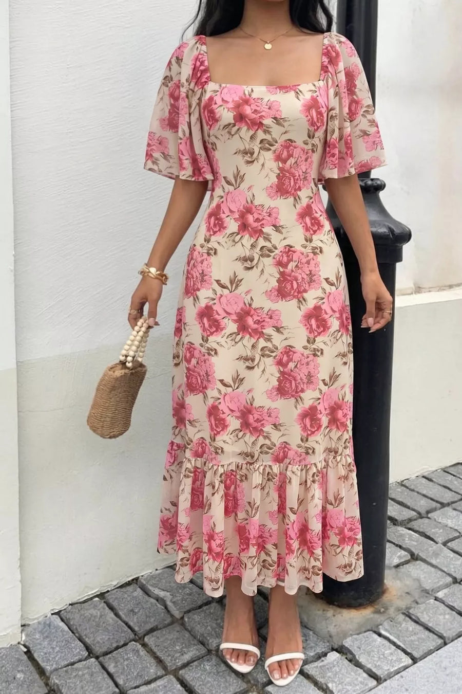 Charming floral midi dress with square neck, flutter sleeves, and ruffled hem.