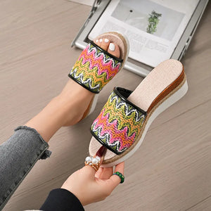 Zigzag embroidered espadrille platform slides with braided jute detail.