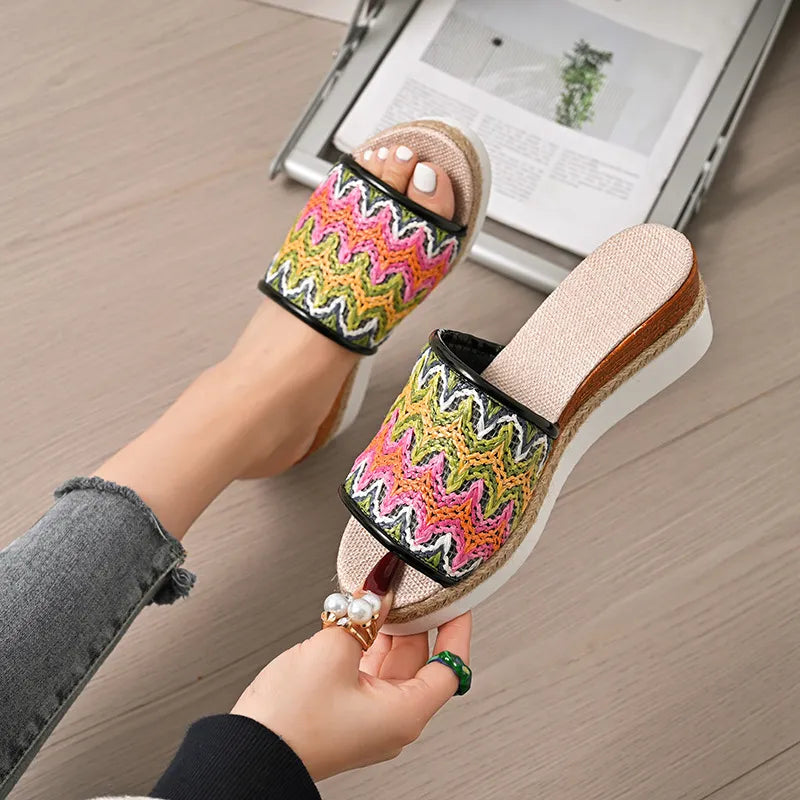 Zigzag embroidered espadrille platform slides with braided jute detail.