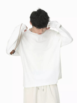 Relaxed fit white cotton long sleeve t-shirt with crew neck.