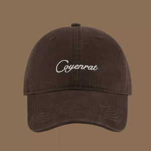 Brown baseball cap with white embroidered text