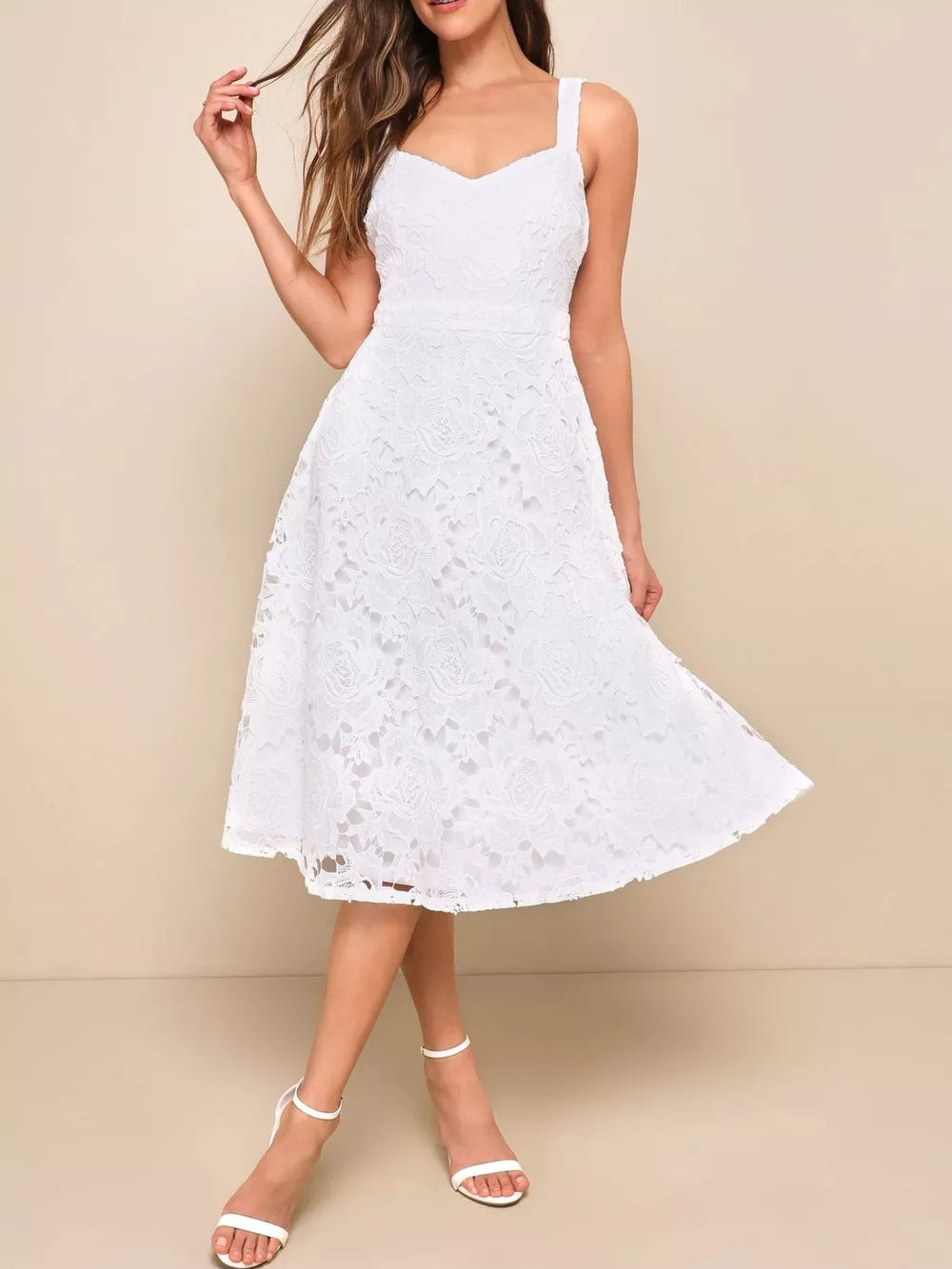 White floral lace sweetheart midi dress with a flared skirt and wide straps.