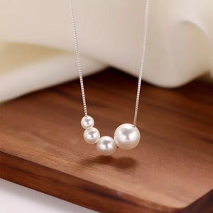 necklace in ivory with pearls and princess-length