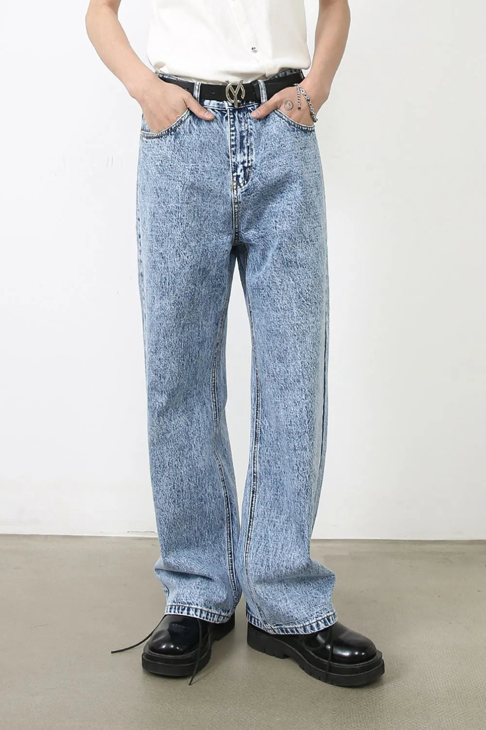 Acid wash wide-leg jeans in medium blue denim with a relaxed fit.