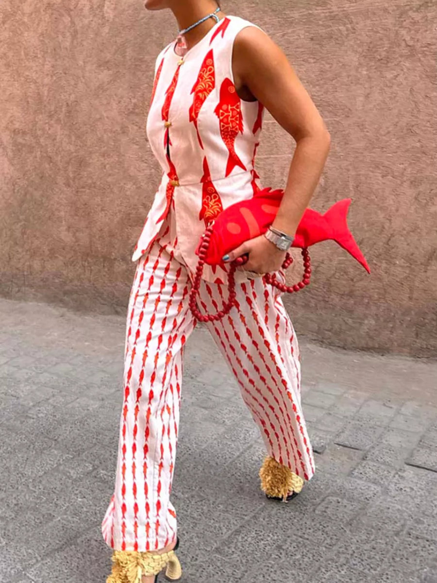Red fish-print sleeveless button-up top and striped pants set with gold buttons.