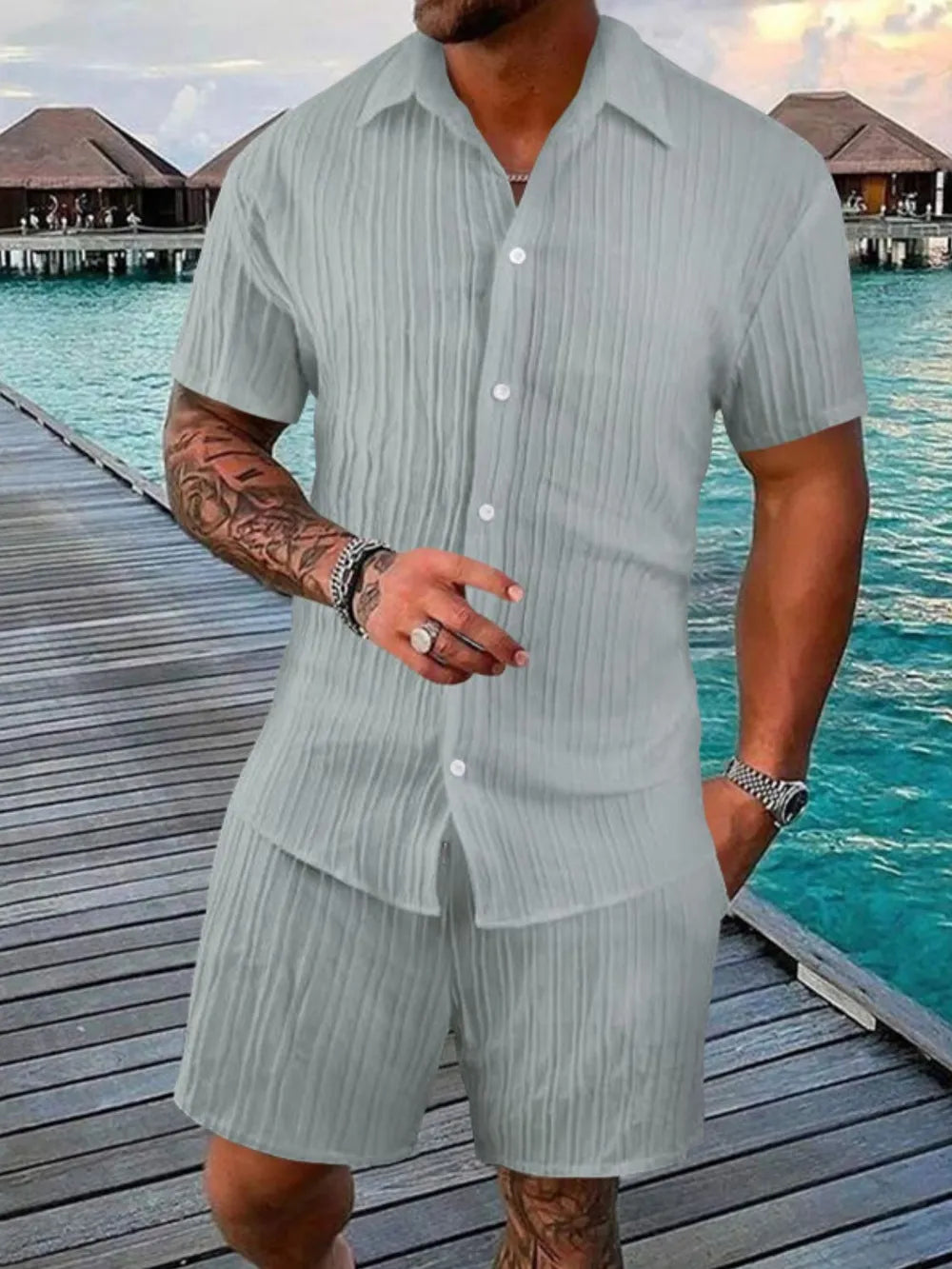 Textured gray resort shirt and shorts set with button-down short sleeve shirt and elastic waist shorts.