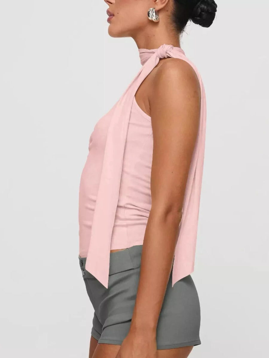 Pink sleeveless tie-neck top with draped front detail.