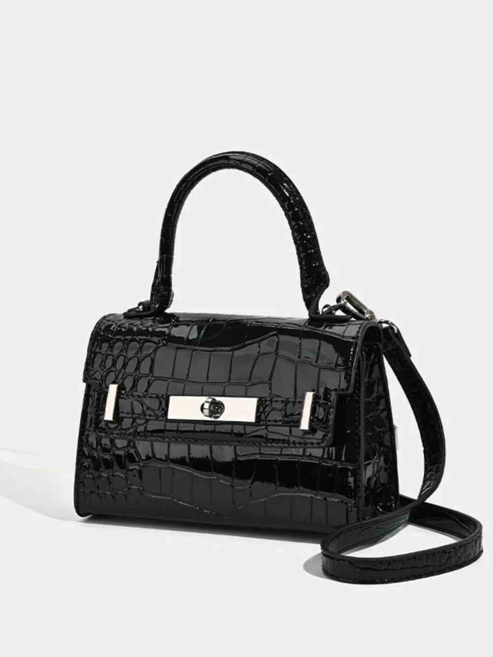 Black croc-embossed small tote bag with silver hardware and adjustable strap.