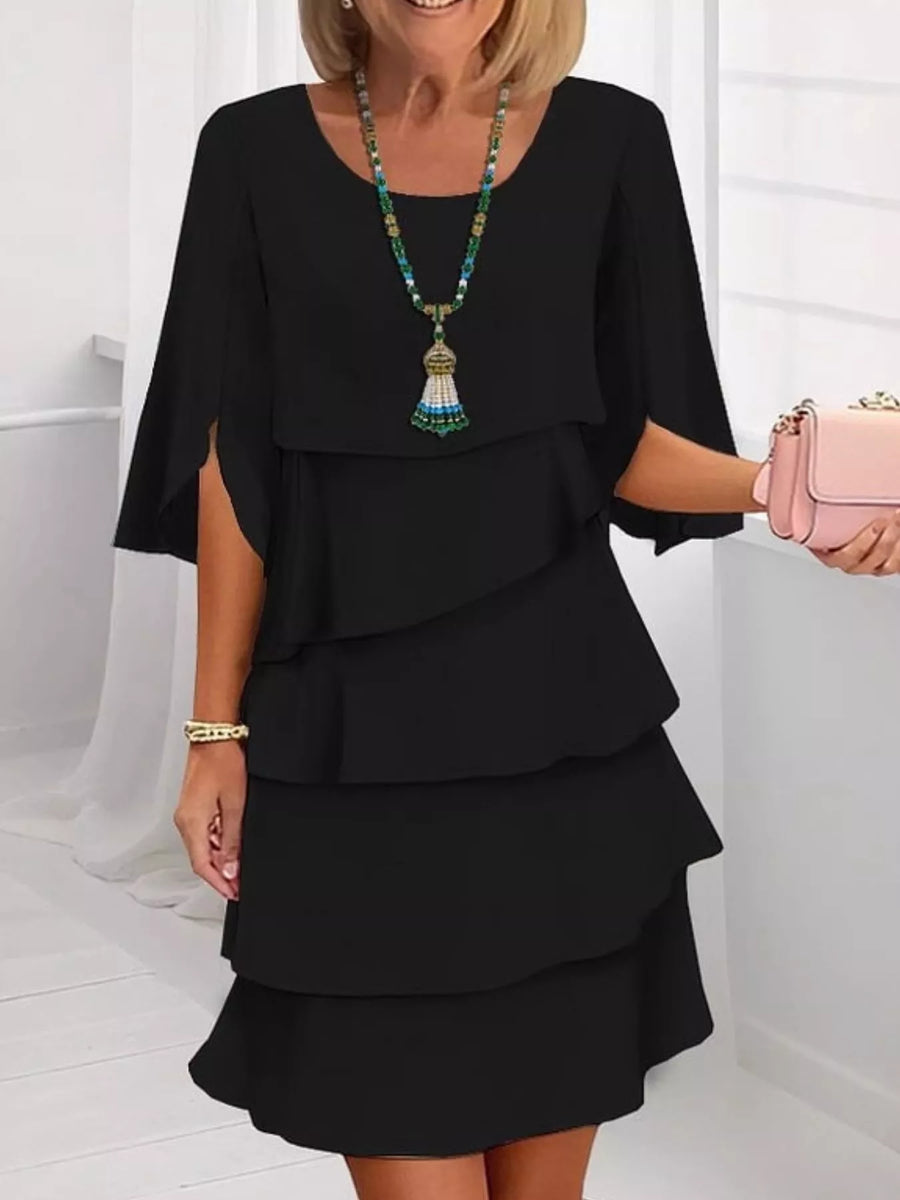 Black ruffled layered flutter sleeve dress with tiered skirt and split sleeves.