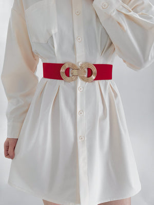 Red stretch belt with interlocking gold circles buckle