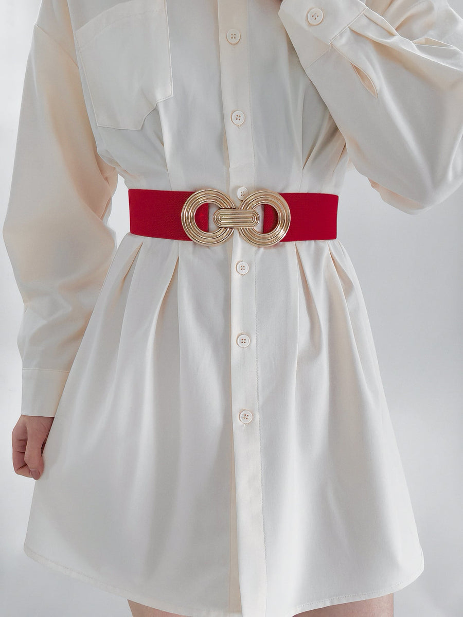Red stretch belt with interlocking gold circles buckle