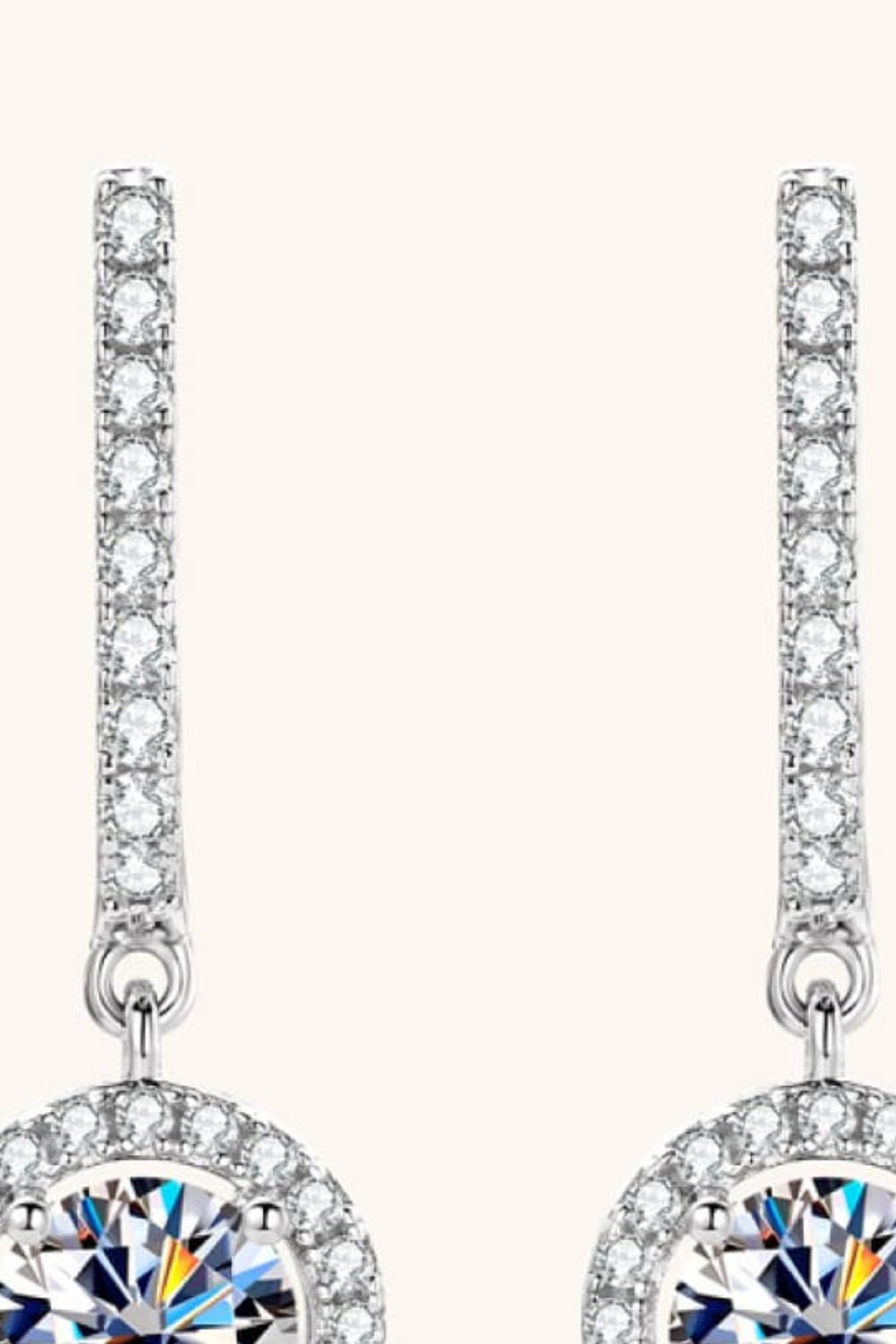 Silver pavé halo drop earrings with a central faceted stone
