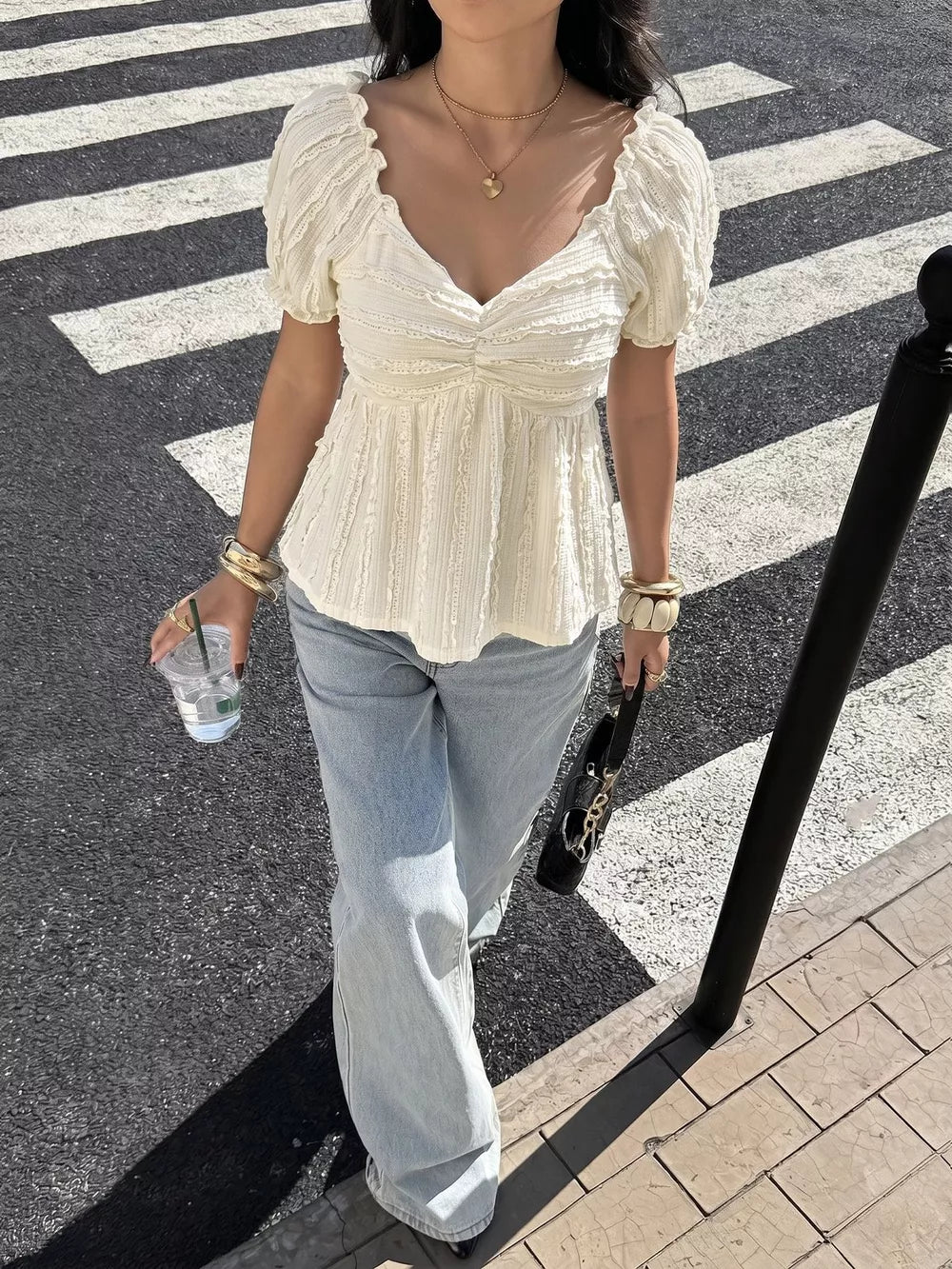 Charming textured white maternity t-shirt with puff sleeves and ruched neckline.