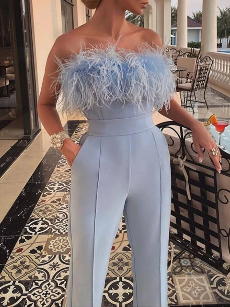 Light blue strapless feather trim jumpsuit with wide legs and pockets.
