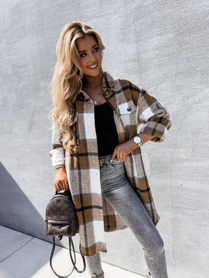 Checkered collar shirt jacket in camel and white with black plaid, long sleeves, and button front.