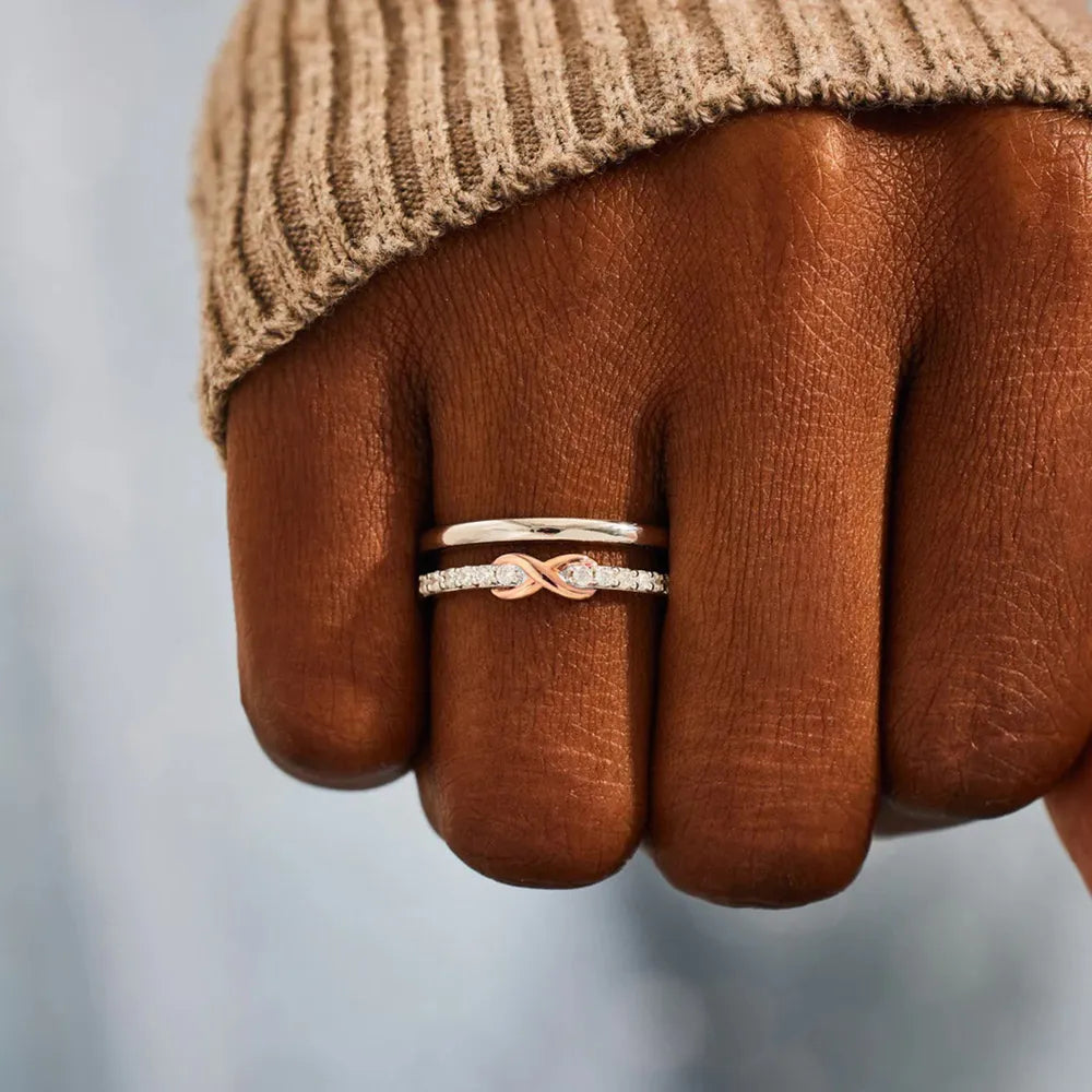 Infinity knot trio ring set in silver with cubic zirconia accents.