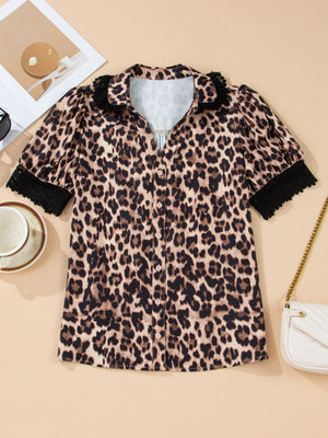 Women's leopard print short sleeve shirt with black lace trim collar and cuffs.