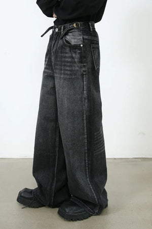 Dark sculpted flare denim trousers with a wide leg and belt detail.