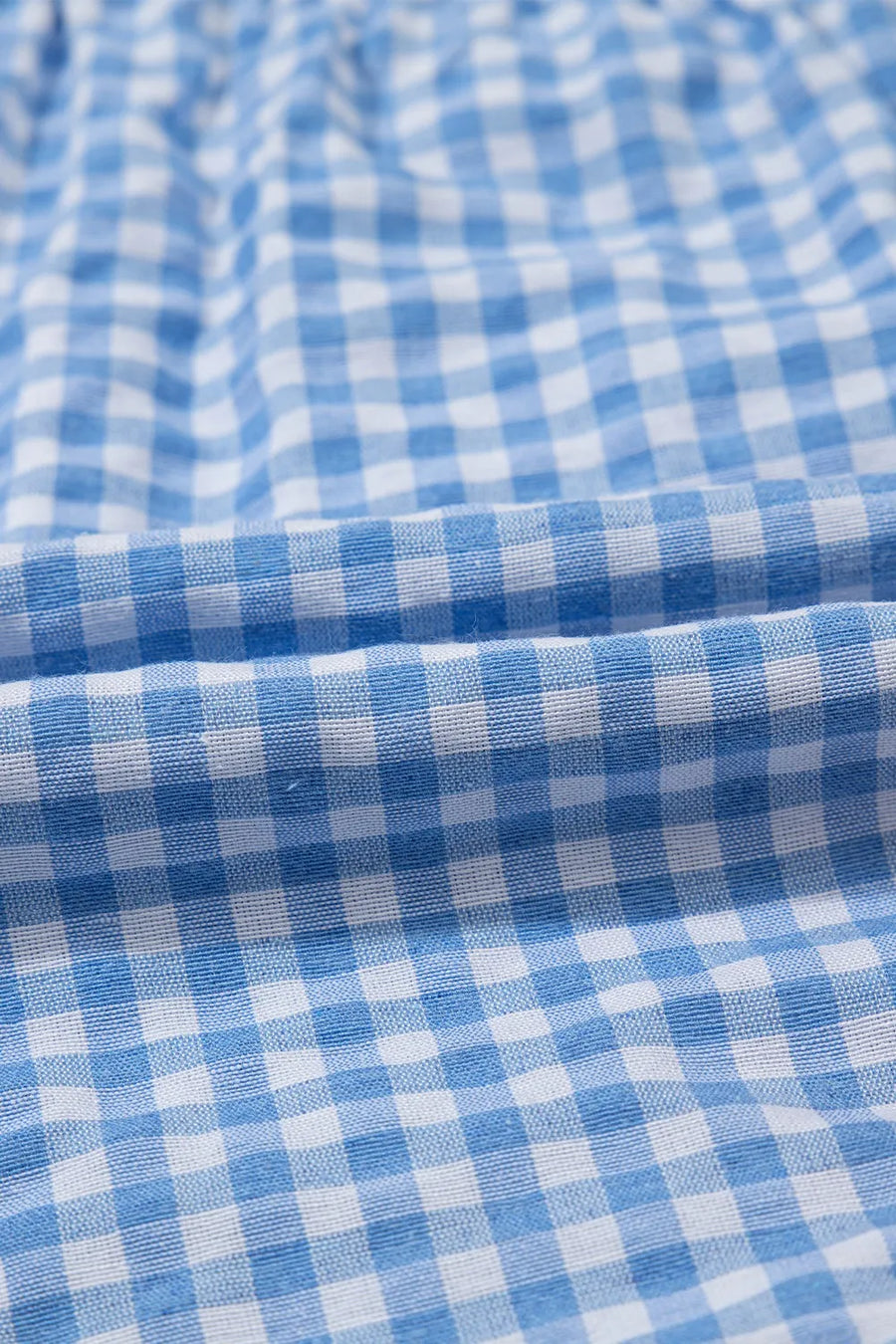 Light blue gingham boxer-style shorts with a high-rise fit.