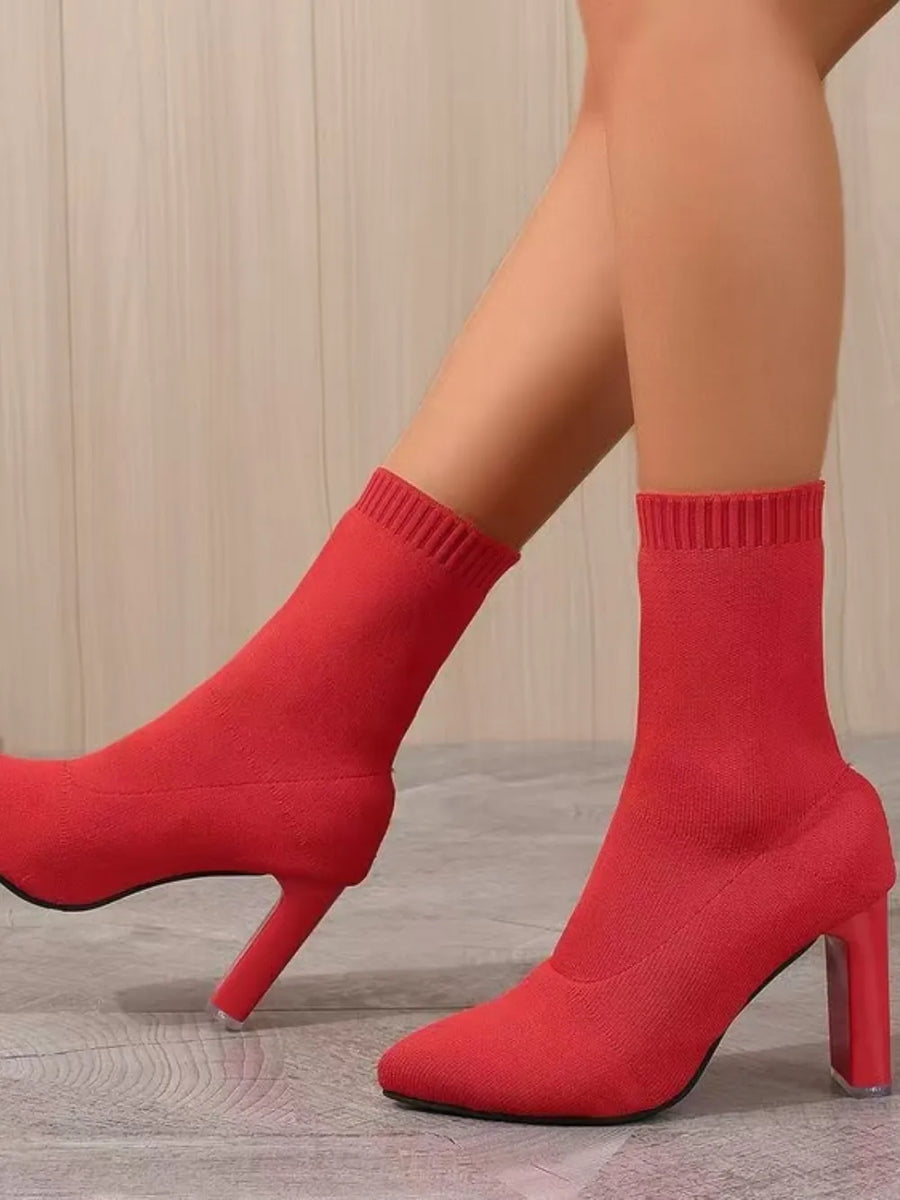 Red knit sock booties with a sculpted heel and pointed toe.