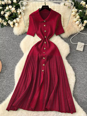 Red knit Peter Pan collar dress with short sleeves and button front.