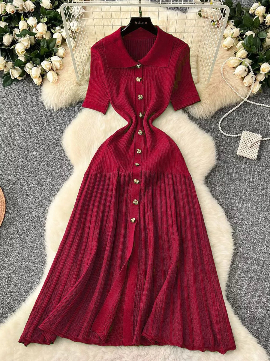 Red knit Peter Pan collar dress with short sleeves and button front.
