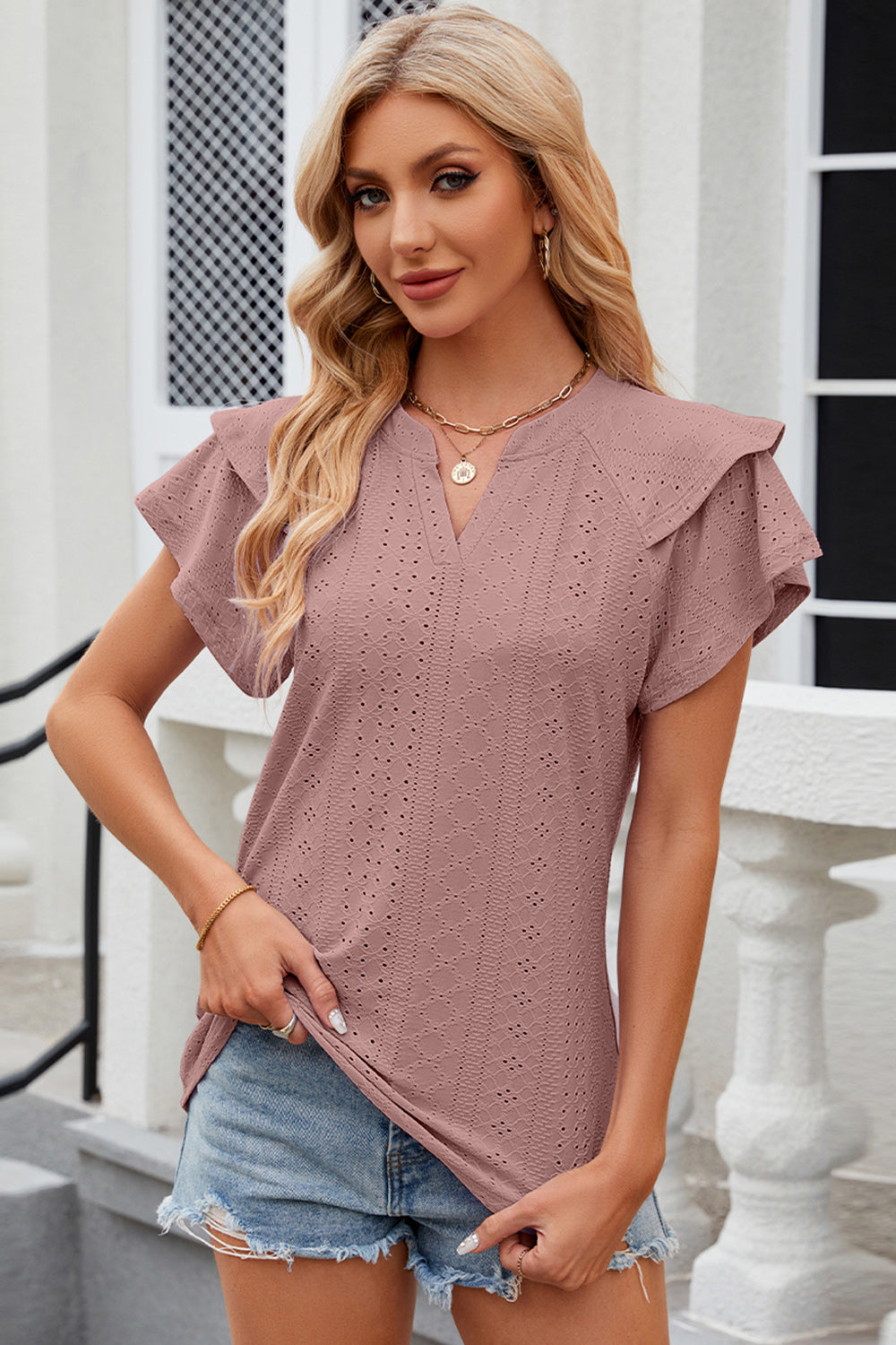 Dusty pink eyelet blouse with flutter sleeves and V-neck.