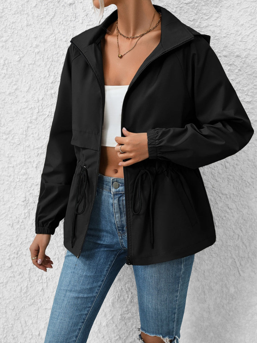 Black hooded utility jacket with cinched waist and drawstring details.
