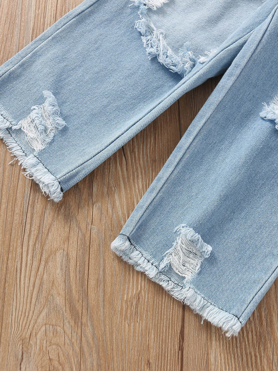 Toddler light wash denim jeans with distressed rips and frayed hems.