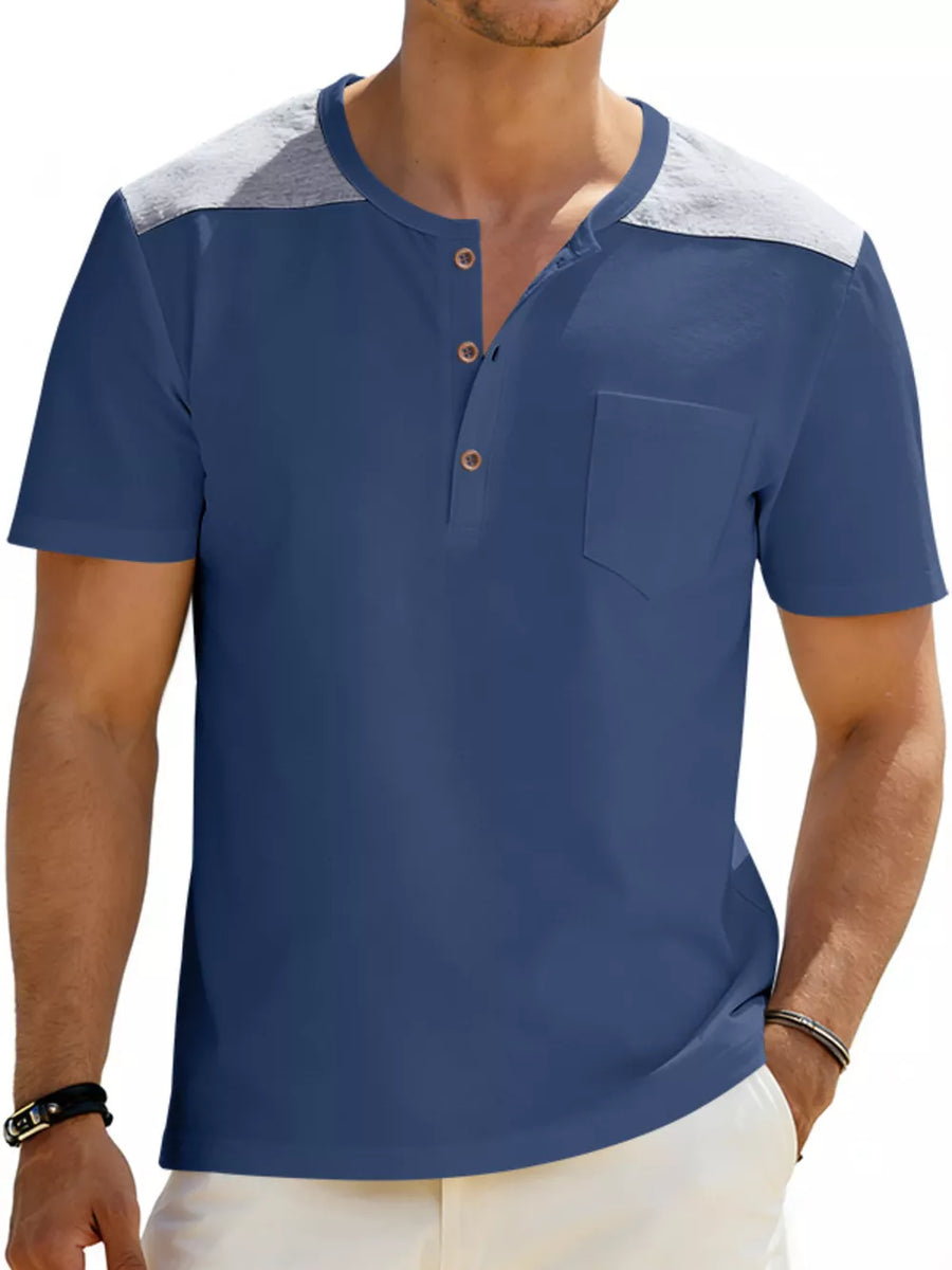 Blue short sleeve henley t-shirt with contrast gray shoulder panels and chest pocket.