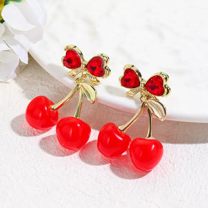 red earrings featuring drop design and novelty