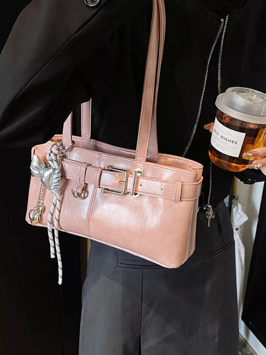 Blush pink shoulder bag with buckle detail and heart charm