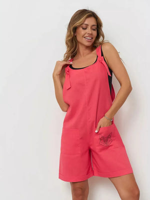 Cotton tie-strap romper in red with embroidered pocket detail.