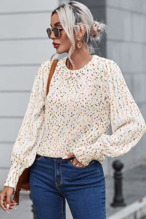Cream confetti speckle knit sweater with puff sleeves and crew neck.