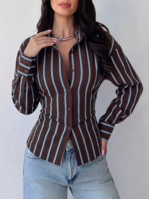 white button-down shirt featuring buttoned and striped