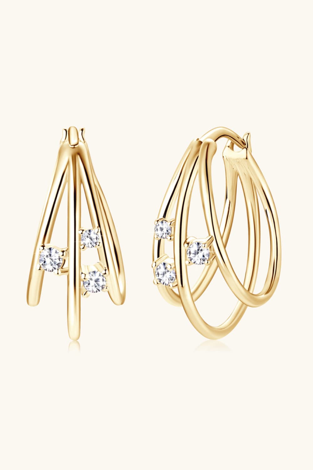 Gold hoop earrings with sculptural design and cubic zirconia accents