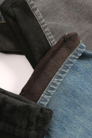 Faded denim jeans with plush fleece lining in dark gray and blue.