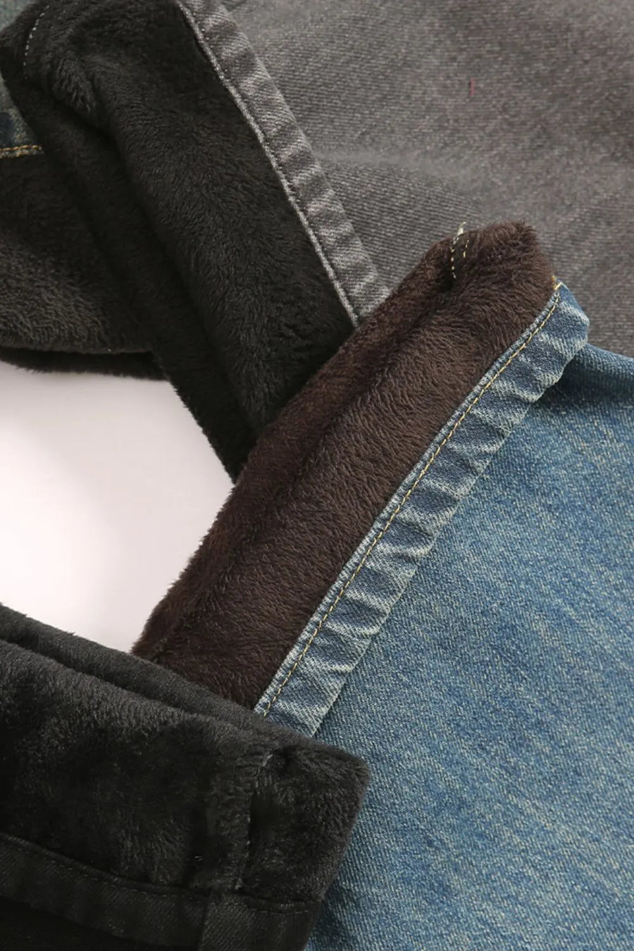Faded denim jeans with plush fleece lining in dark gray and blue.