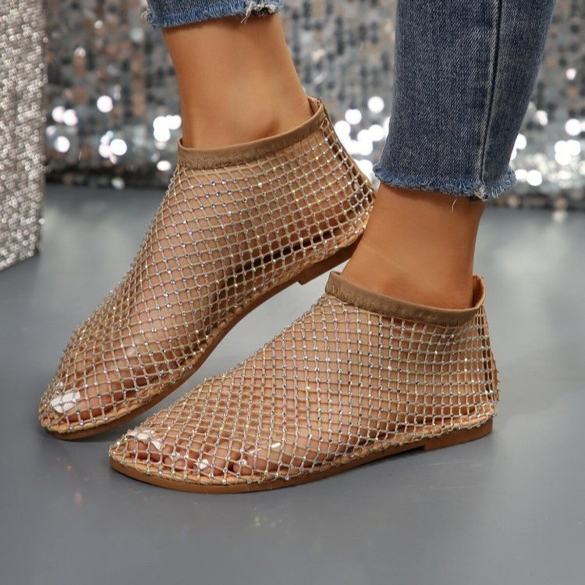 Glistening rhinestone mesh ankle boots in tan with a round toe.