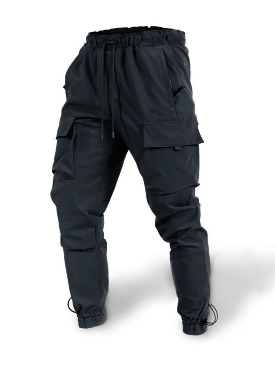Black tech-utility cargo joggers with drawstring waist and ankle cuffs.