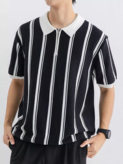 Black and white striped cotton polo shirt with quarter-zip neckline and white collar.