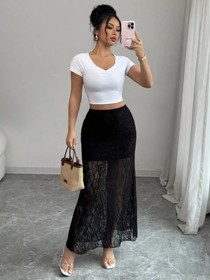 Black lace maxi skirt with sheer lace overlay and lace trim hem.