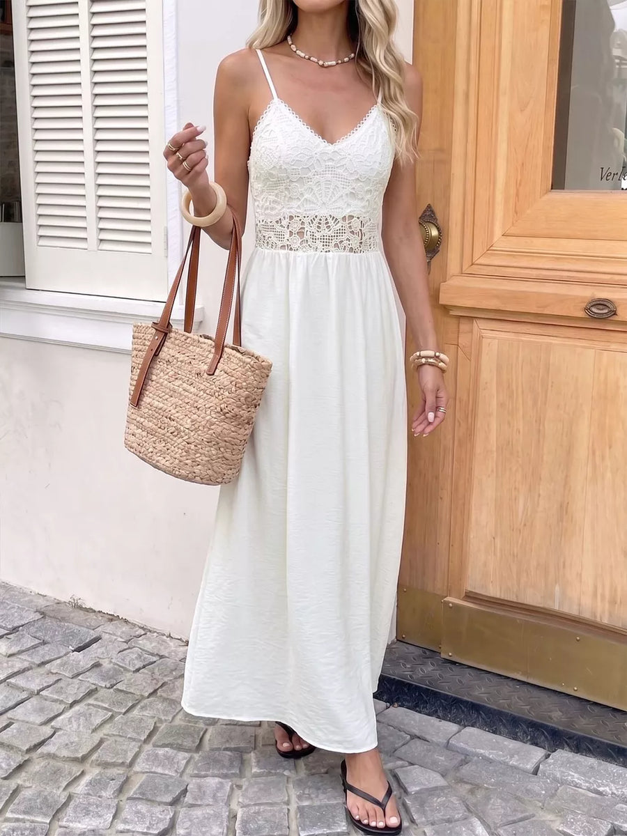 White lace-detail V-neck maxi dress with cutout waist and spaghetti straps.