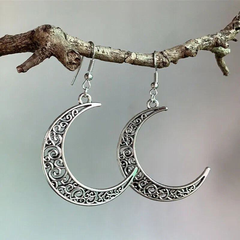 Filigree crescent drop earrings in Moon color, made of alloy with intricate scrollwork.
